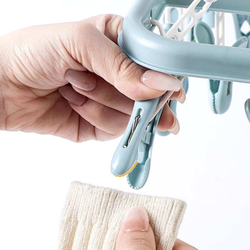 Windproof 32-Clip Plastic Hanger: Multifunctional Clothes & Socks Drying Rack for Adults & Children, Portable and Durable.