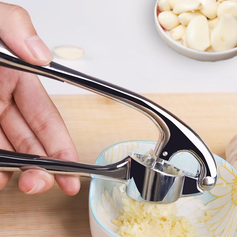 Manuell hvitløkspresse og stamper for kjøkkenbruk