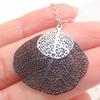 Gun Black Leaf Pendant Necklace – Hollow Design for Women – Cross-border Fashion Statement