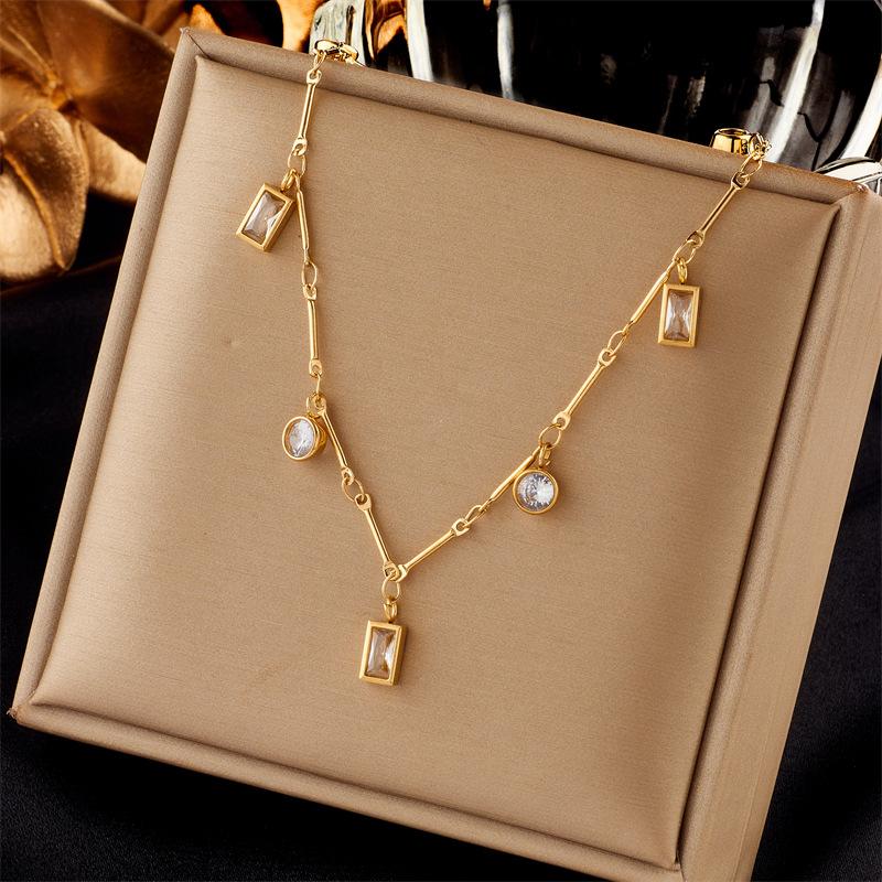 

Luxury Gold-Tone Titanium Steel Necklace with Baguette-Cut Clear Crystals & Round Rhinestones – Elegant Dangle Chain Design one size
