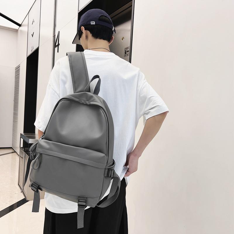 Cool backpack men's leather PU large-capacity college style casual backpack Japanese simple college student schoolbag women