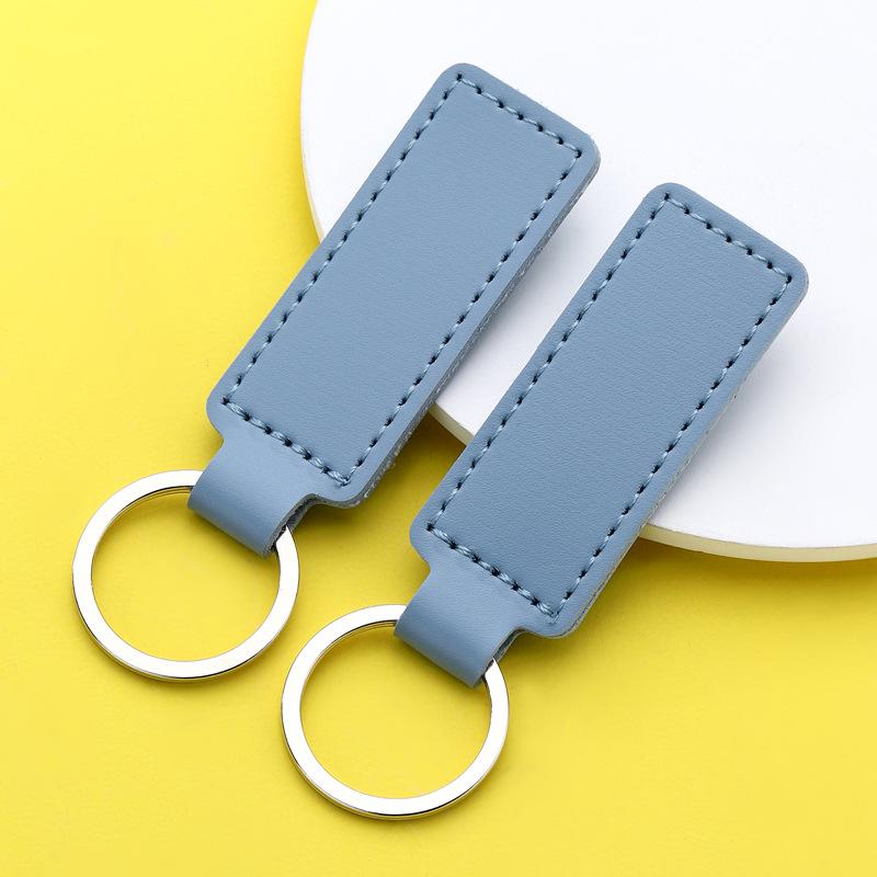 

Solid Color PU Leather Keychain: Elegant Gift Pendant for Couples & Car Keys світло-синій колір