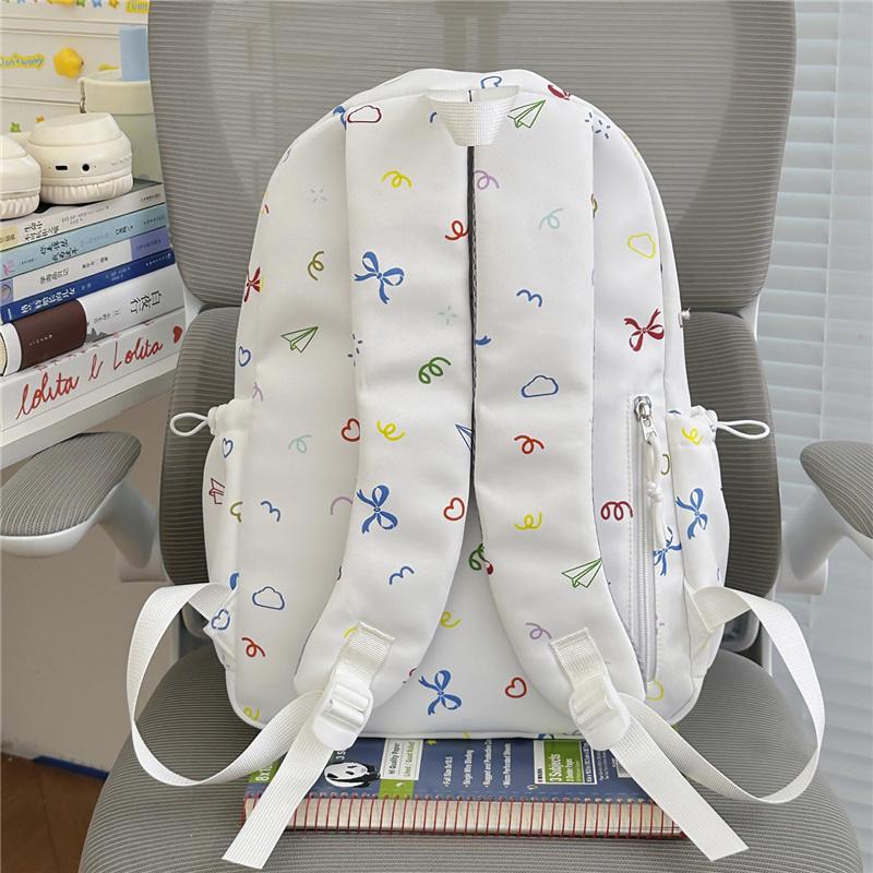 Cute Bow Tie Print School Backpack Lightweight Nylon Zipper Daypack with Front Pocket for Teen Girls Daily Travel