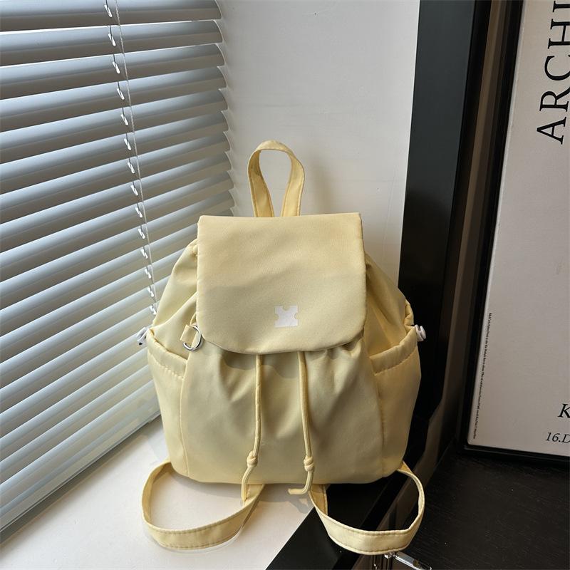 

Plaid canvas mountaineering bag women s 2025 new trendy Korean college backpack casual backpack shoulder bucket bag жовтий