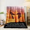 A wooden cross draped in cloth set against a vibrant sunset background. for all seasons blanket lunch break throw gift