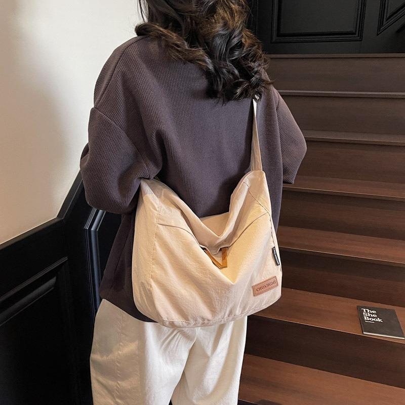 Large-capacity cloth bag women's new summer simple and versatile shoulder messenger bag class commuter dumpling bag