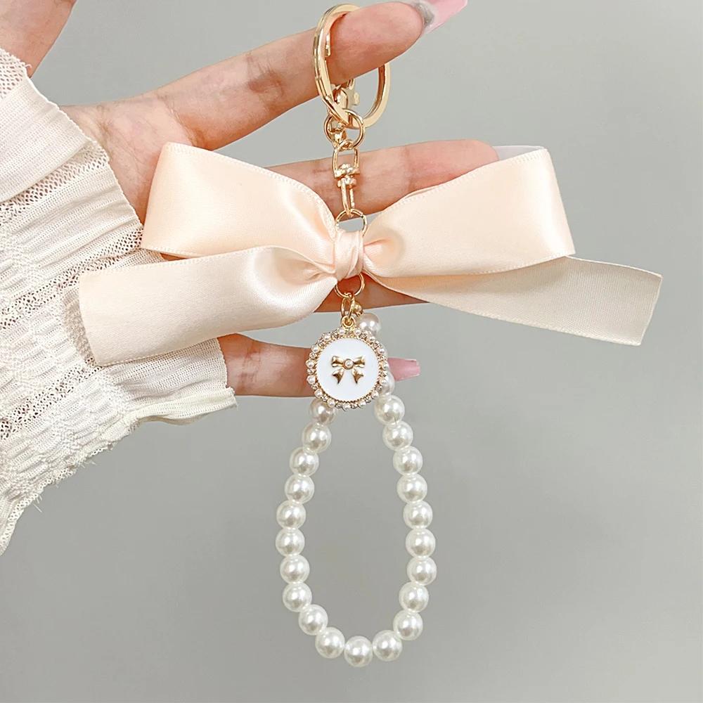 

2026 New Fashion Imitation Pearl Keychain Sweet Ribbon Bowknot Keyring Accessories Metal Buckle Women Bag Bow Best Gifts Jewelry бежевый