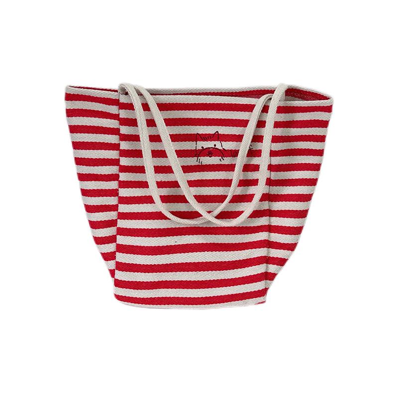 Large capacity striped canvas bag women's 2025 new niche embroidery lazy wind commuter portable shoulder tote bag