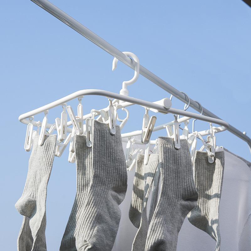 Portable White Plastic Clothes Hanger With 24 Clips For Efficient Drying