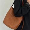 First layer vegetable tanned cowhide hand-woven bucket bag, high-end niche design, genuine leather single shoulder crossbody commuter bag for women