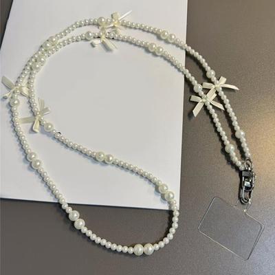 Lanière de téléphone universelle anti-perte avec cordon et joint, longue bandoulière avec nœud en perles, chaîne de téléphone portable pour femme, longue sangle de cou et d'épaule