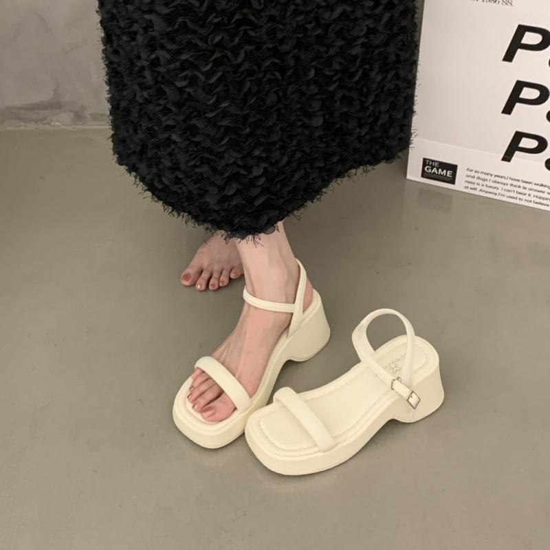 

thick-soled wedge sandals women s 2025 new summer wear with skirt black heel beach Roman sandals 35