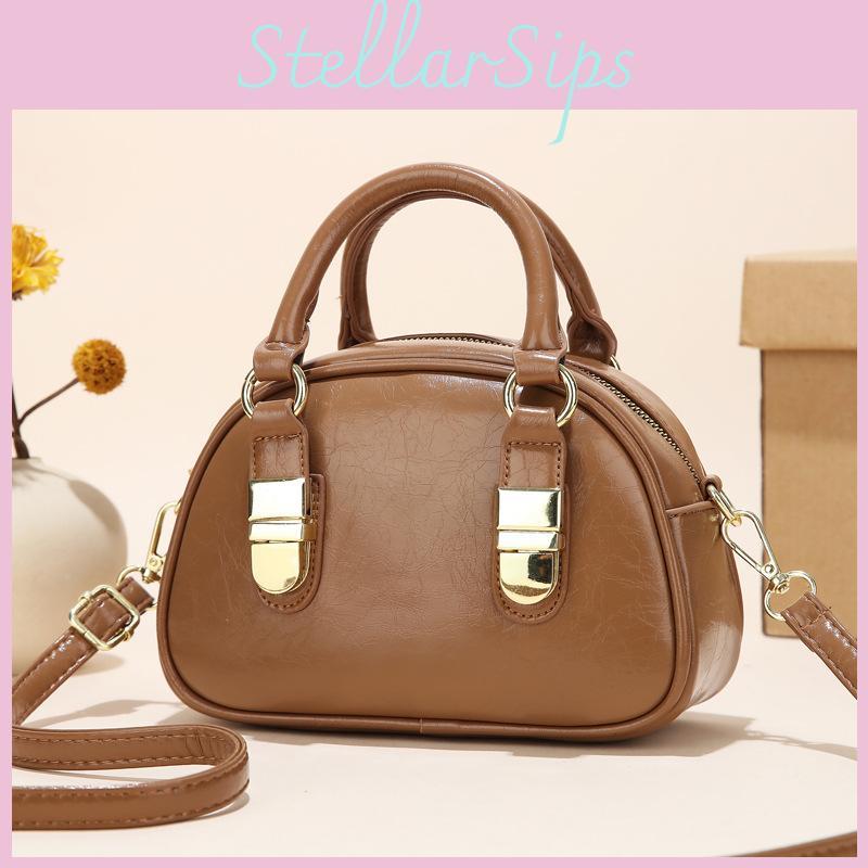 Spacious Elegant And Shoulder Bag For Women With Unique Shell Shape And Durable Lining Polyester