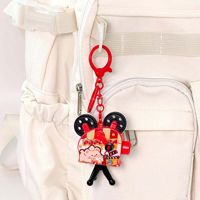 1 box of popcorn projector keyrings (6 pieces)