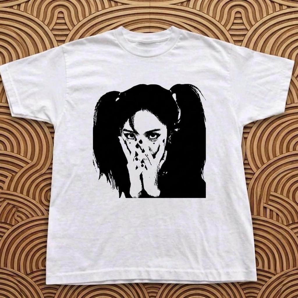 White graphic tee with black graphic of a woman with pigtails covering her mouth