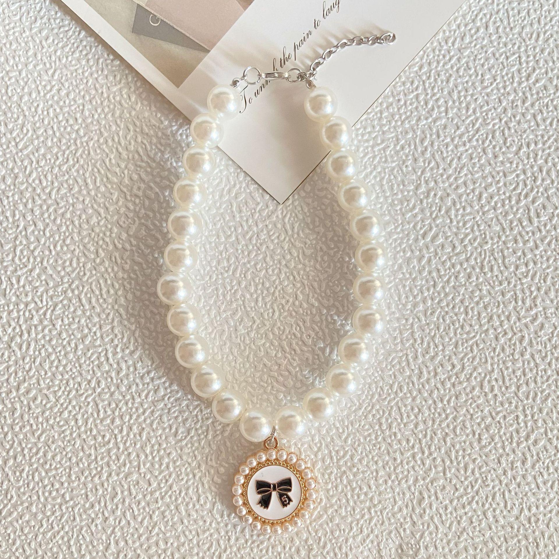 

Xiaoxiangfeng pendant, pearl pet bow, cat and dog necklace, supplies, muppet hot model, anti-lost. Small size s білий