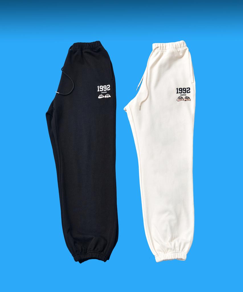 Daenkkomma Crayon Shin-Chan 1992 Face Embroidery Sweatpants (Black, Cream)
