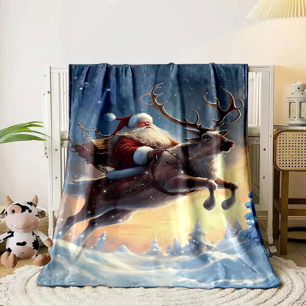 Santa riding a reindeer through a snowy landscape at sunset. for all seasons blanket lunch break throw gift 80cm x 120cm