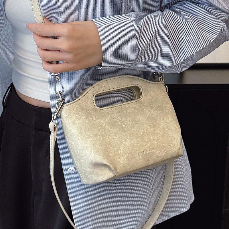 Wholesale simple style texture portable bucket bag fashion casual women commuting niche design messenger bag