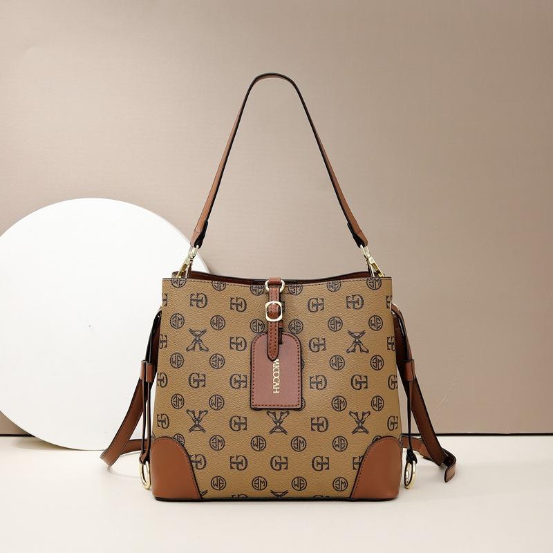 

Spring and summer new women s bags, letter retro printing, portable bucket bag, high-end contrasting color tote bag, shoulder messenger bag.