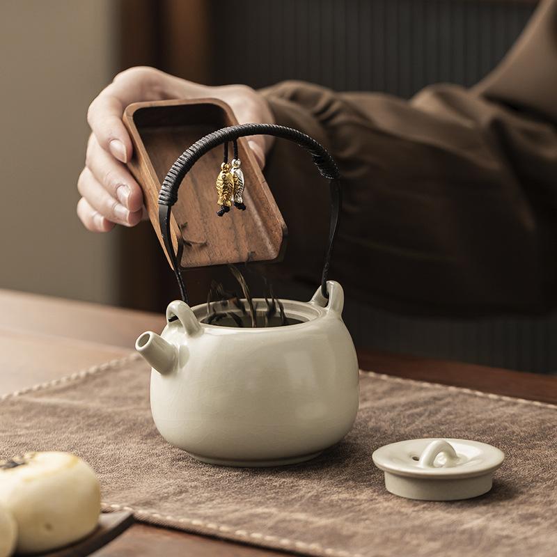 Light luxury beige Ru kiln lifting beam pot Kung Fu tea set, high-end tea making, household tea kettle, single pot tea making device