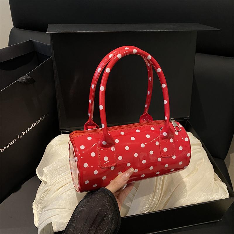 Niche polka dot bag women's 2025 bag new French retro underarm messenger bag exquisite portable women's bag cylindrical bag