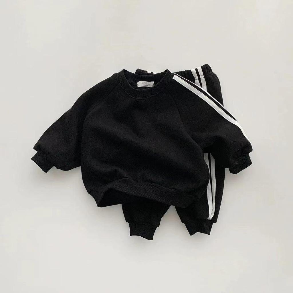 Korean-Style Unisex Baby Sweatshirt and Pants Set - Solid Color with Webbing Stripe Patchwork for Autumn and Spring.