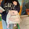 High-value girls toilet bag, simple casual small backpack, cute bow floral college style flip backpack.