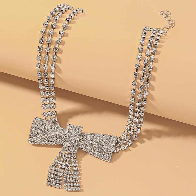 

Luxury Diamond Bow Multi-Layer Choker Necklace – Elegant High-End Hip Hop Style for Women