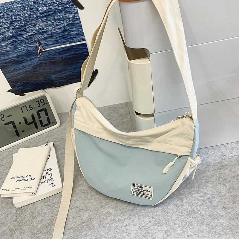 

Nylon cloth bag women s large-capacity new summer contrasting color shoulder messenger bag casual commuter dumpling bag синий