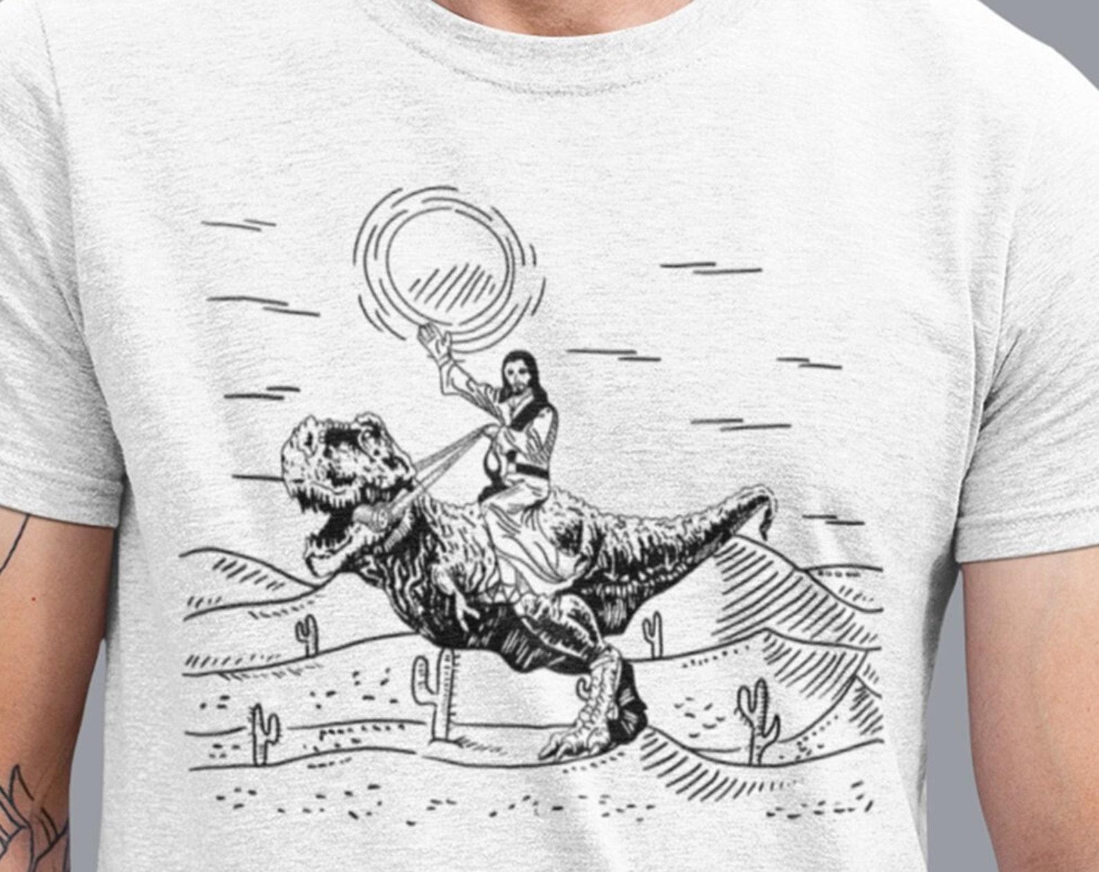 Jesus Riding Dinosaur T-Shirt, Funny Offensive Jesus Shirt, Cool Novelty Shirts, 90s Graphic Tee For Men Women Tee, Graphic Faith T-Rex Tee L