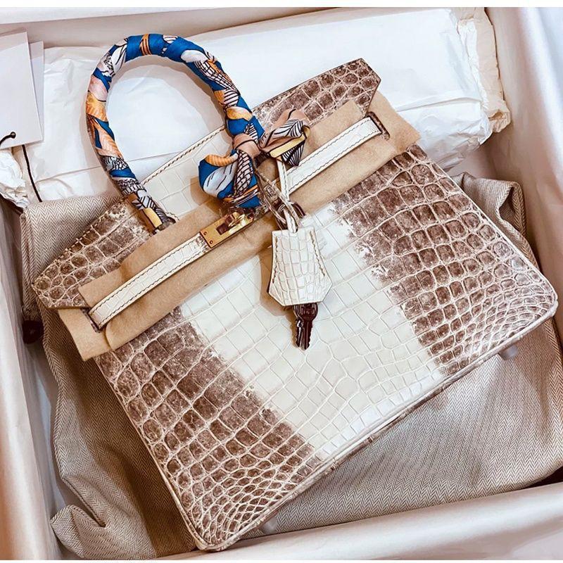 La borsa da donna Yijinyuan ha solo trent'anni. Stessa Borsa. Borsa a Mano in Vera Pelle con Fantasia Coccodrillo a Gradiente Platino 2021. Pendolare.