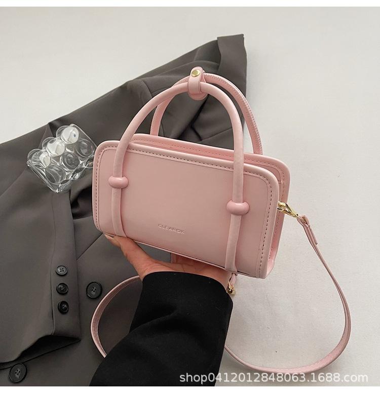 

This year s popular fashion and simple Korean cream style solid color portable small square bag commuting versatile texture messenger women s bag