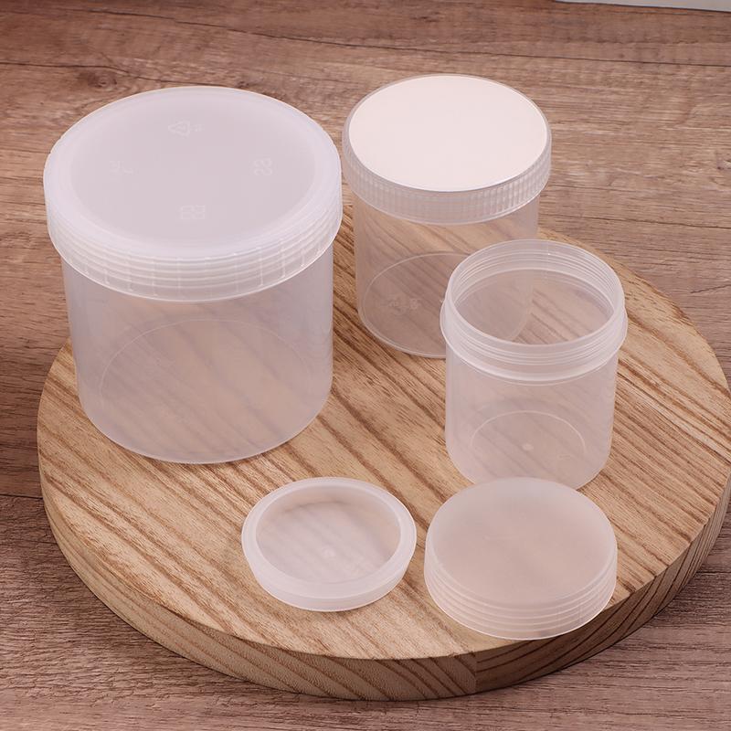 Průhledná uzavřená plechovka s víkem Plastová prázdná balící láhev Kruhové úložiště kbelík Sklenice na sušenky Potravinářské uzavřené plechovky Nádržka