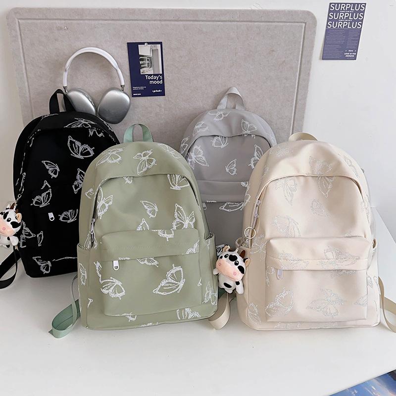 High-value reflective butterfly backpack, new junior high school girl high school student schoolbag ins niche travel backpack