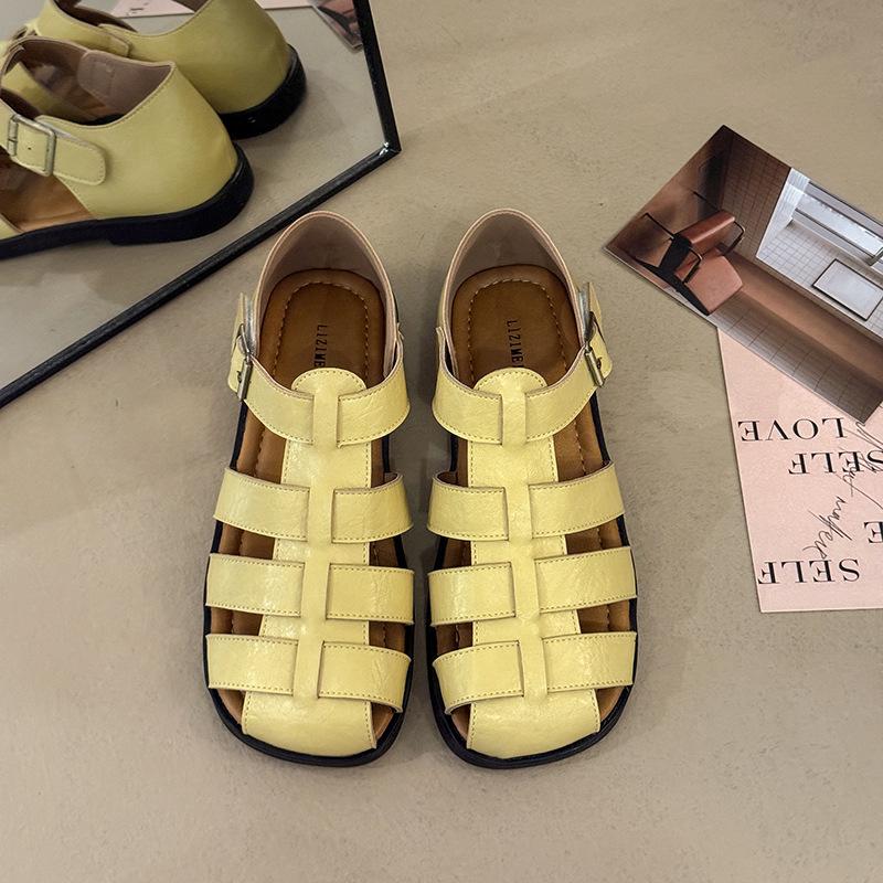 2025 summer new bag head hollow soft sole Roman shoe buckle flat bottom woven retro large size beach sandals women