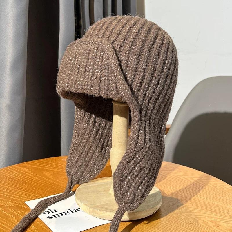 Autumn and winter pink knitted wool hat women's lace-up ear protectors flying hat warm versatile face small ski Lei Feng hat