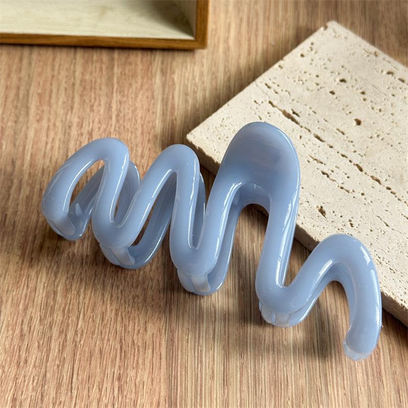 Fluid Wave Silhouette Hair Clip In Dreamy Translucent Hues Provides Secure Hold For Messy Buns And Modern Minimalist Updos