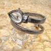 Damen Armbanduhr mit Tropfenförmigem Kopf und Schlangenförmigem Armband