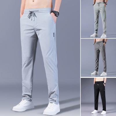 Men Pants Solid Color Drawstring Mid Waist Pockets Loose Streetwear Straight Working Trousers for Daily Wear