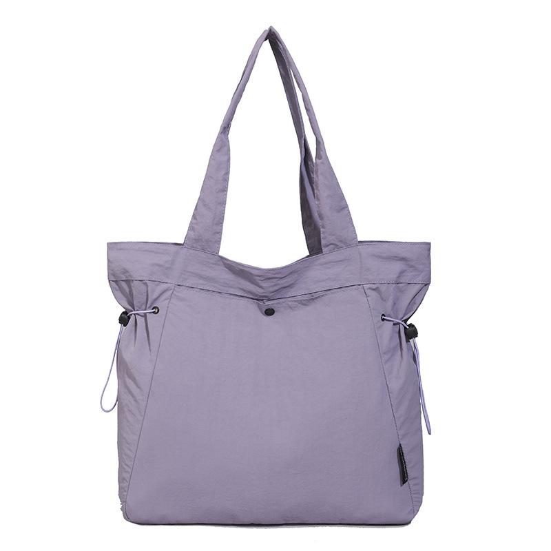 Simple and fashionable 2025 summer new fashion shoulder bag women's casual solid color large-capacity tote commuter bag