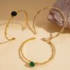 Elegante bracciale rigido aperto in acciaio al titanio e pietra naturale per donna