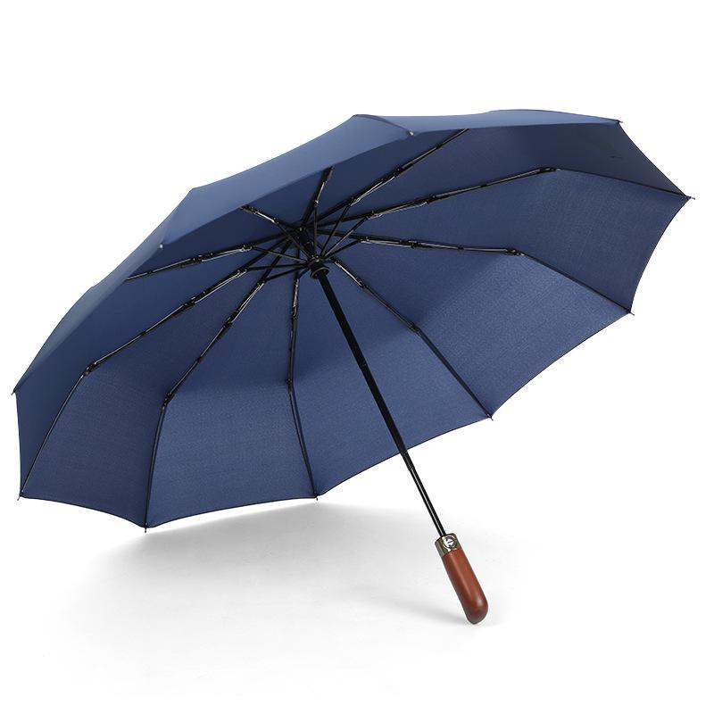 Fully automatic 10-bone wind-resistant solid wood handle lettering three-fold men's umbrella umbrella plus umbrella