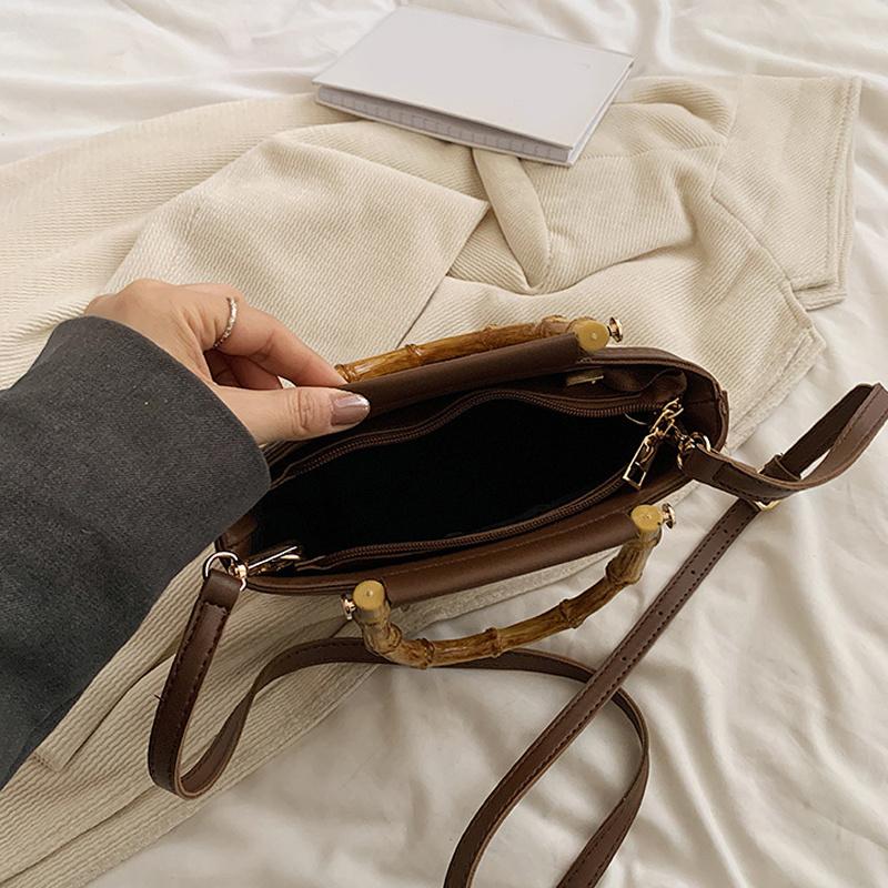 Weaving Bag Summer New Bamboo Handle Tote Straw Bag Niche Simple Shoulder Crossbody Bucket Bag Women's Bag AVE