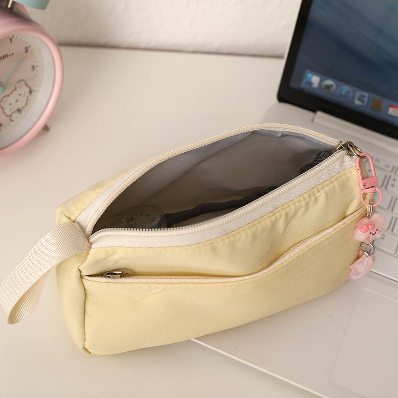 Nouvelle trousse à crayons Ins Grande capacité Mignon Sac à fournitures scolaires Simple pochette à crayons Portefeuille à monnaie pour étudiant Pochette à monnaie Sac de maquillage portable
