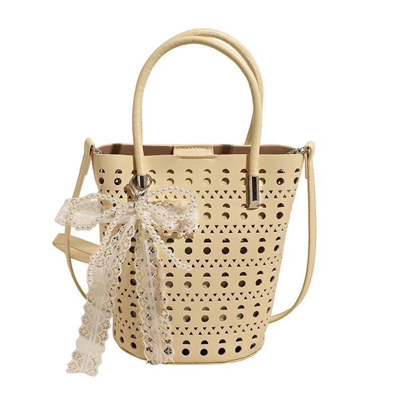 Large capacity shoulder bag 2025 summer new niche handbag hollow design women's bag PU armpit bag bucket bag