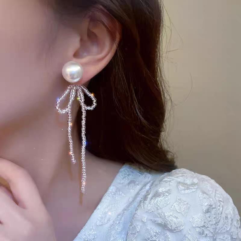 New temperament fringed bow earrings female, niche design handmade pearl Internet celebrity earrings earrings