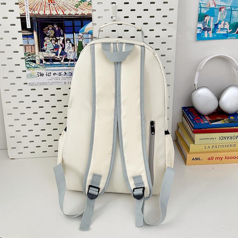 Simple and fashionable student backpack New casual outdoor sports backpack Middle school student large-capacity college style schoolbag