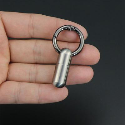 Kompaktowy wodoodporny tytanowy pojemnik na tabletki: Mini kapsułka na leki, odporna na wilgoć, ze stali nierdzewnej.