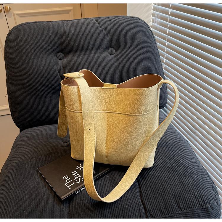 

Korean version of bucket bag women s 2025 spring new women s bag large-capacity messenger bag high-end texture simple shoulder bag жёлтый